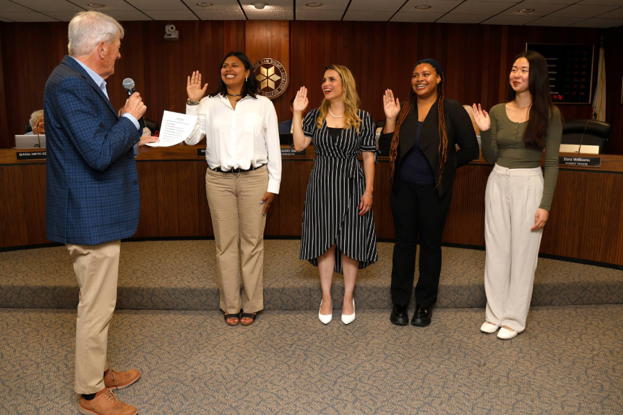 Board President Bernie Rhinerson swears in the four student trustees during the June 2024 Board of Trustees meeting. From left, Rhinerson, Dalia Ramirez (City College), Haydee Zuniga (College of Continuing Education), Zora Williams (Mesa College), and Hailey Hua (Miramar College).